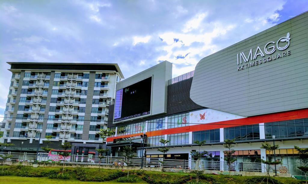 Discover the Top Event Roadshow Venues in Kota Kinabalu, Sabah 2 Exterior view of Imago Mall shopping center entrance with green glass architecture in Kota Kinabalu