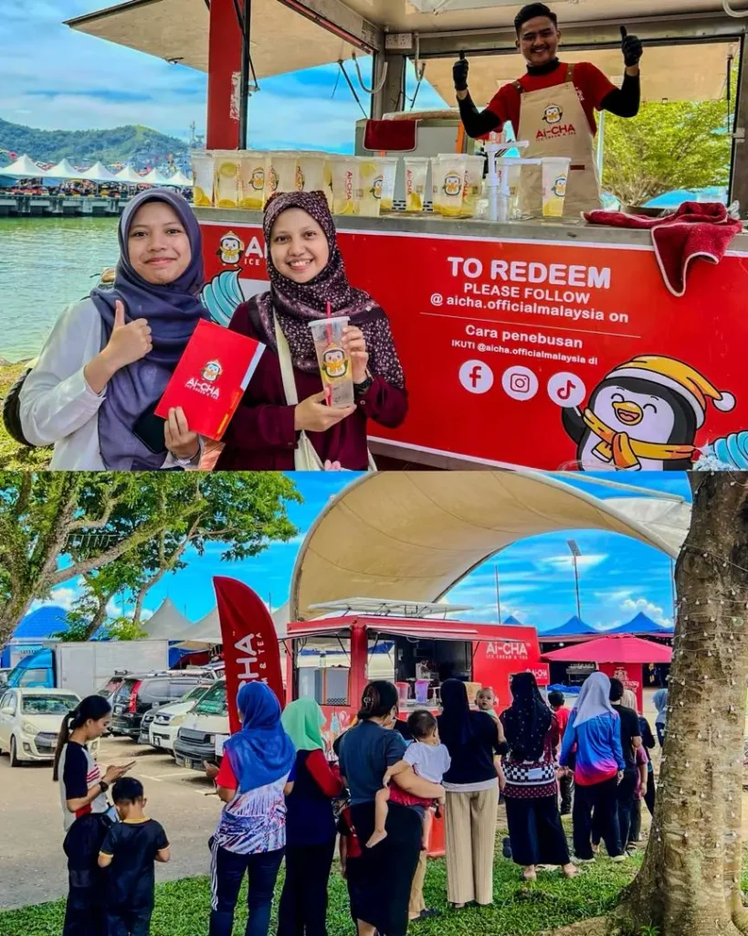Celebrating Ai Cha’s “Love You 300x” Campaign – Brewing Across Sabah! 9 Ai-CHA booth serves drinks to smiling visitors while another line forms beside the red kiosk under shade