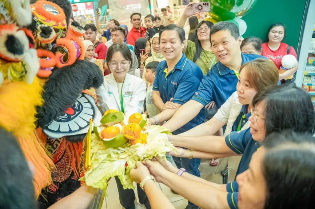 Caring Pharmacy Kaamatan & Gawai Campaign Launch 4 Caring Pharmacy Kuching team and shoppers present a traditional offering to lion dancers