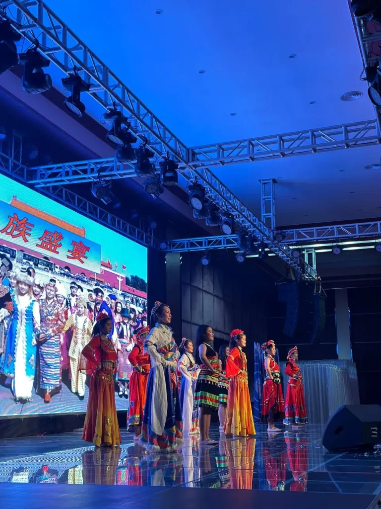 Celebrating Heritage and Legacy: Chung Ling Alumni Dinner in Sabah 13 Cultural dance troupe performing in traditional costumes at the 55th World Chung Ling Alumni Carnival