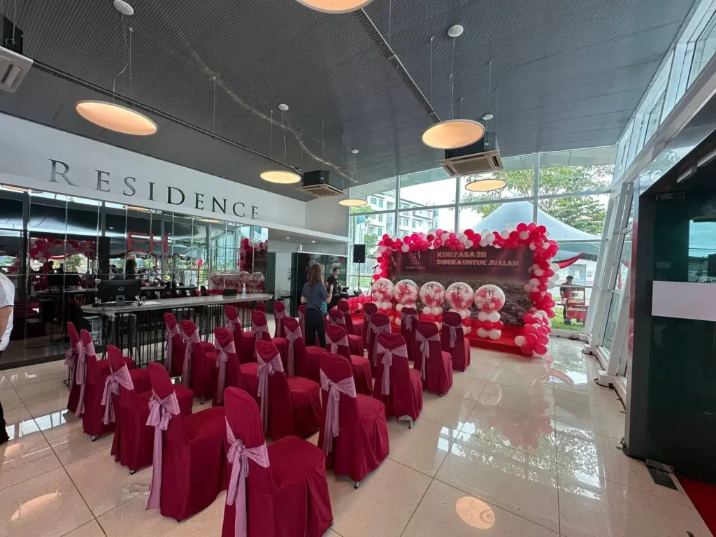 Organized seating and balloon decorations inside E Residence showroom