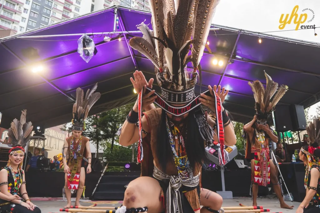 Celebrating the Grand Launch of Curve25 6 Traditional Sabahan indigenous dancers performing on stage