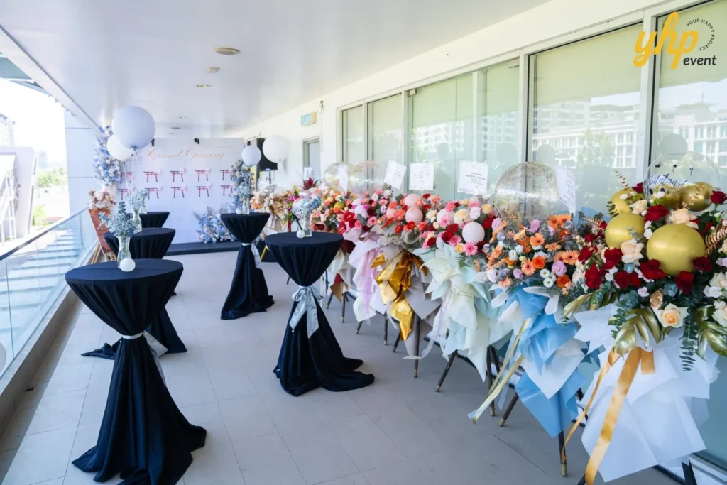 Grand Launching of JIN Omakase: A Culinary Extravaganza in Kota Kinabalu 3 Outdoor reception area for Jin Omakase by Minami decorated with black cocktail tables, balloons, and floral stands