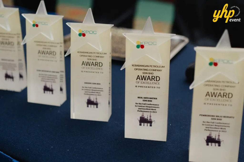 Close up of star shaped acrylic trophies for the KPOC Award of Excellence