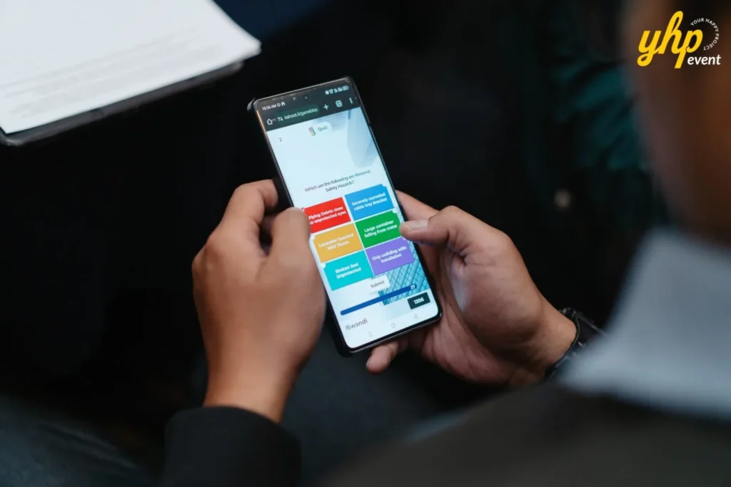 Close up of a participant engaging in an interactive digital safety quiz on a mobile phone