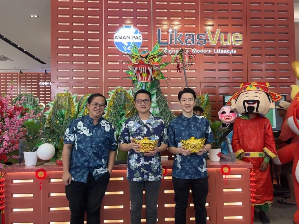 LikasVue CNY Celebration 2024 & A1 Show Unit Launching 6 LikasVue team members posing with festive decorations and dragon head at the Year of the Dragon celebration