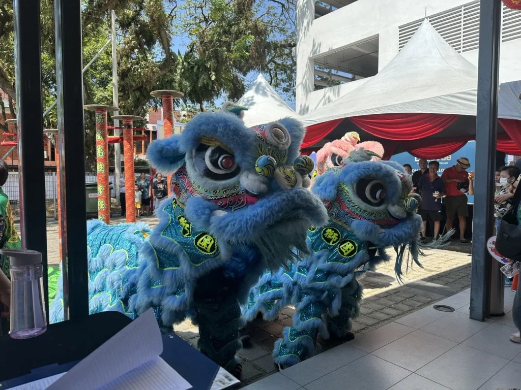 LikasVue CNY Celebration 2024 & A1 Show Unit Launching 7 Blue and pink lion dance troupes performing for visitors at the LikasVue property gallery entrance area