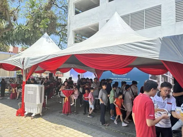 LikasVue CNY Celebration 2024 & A1 Show Unit Launching 9 Guests gathered under outdoor event tents at LikasVue property gallery for a community festive gathering