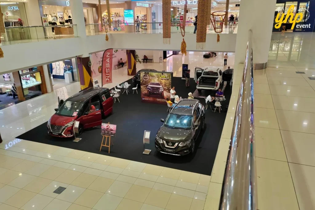 Experience Innovation and Comfort at the Nissan Roadshow 7 Overhead view of Nissan X-Trail and Serena models at an organized indoor mall automotive roadshow