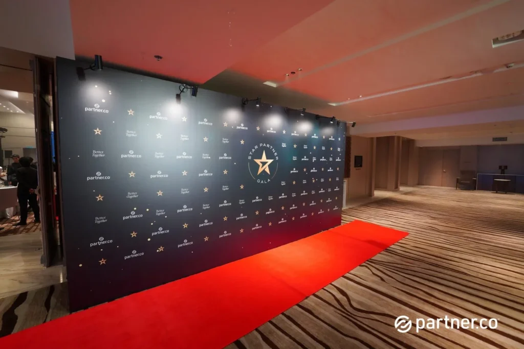 Unleashing the Future of Business: Partner.Co's Star Partner Business Conference & Award Night 3 Event entrance with a red carpet and professional photo backdrop for the Partner.Co Star Partner Gala in Marriot Hotel Kota Kinabalu