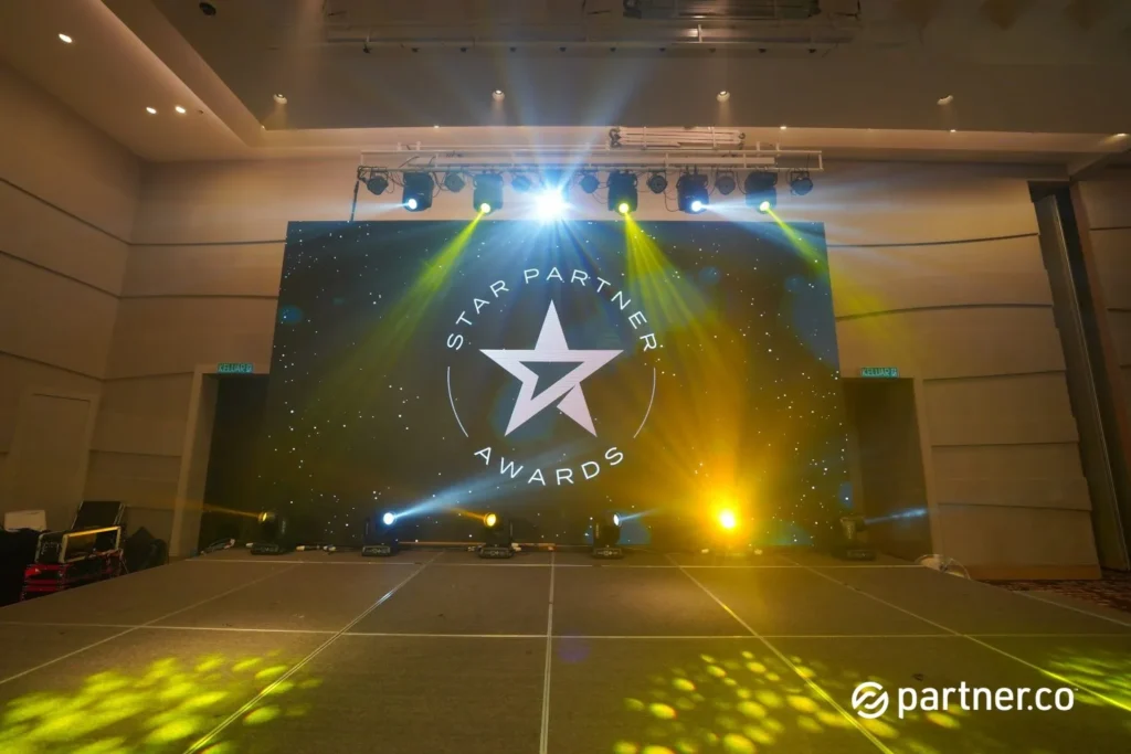 Unleashing the Future of Business: Partner.Co's Star Partner Business Conference & Award Night 4 Main stage setup with professional lighting and LED screen displaying the Star Partner Awards logo