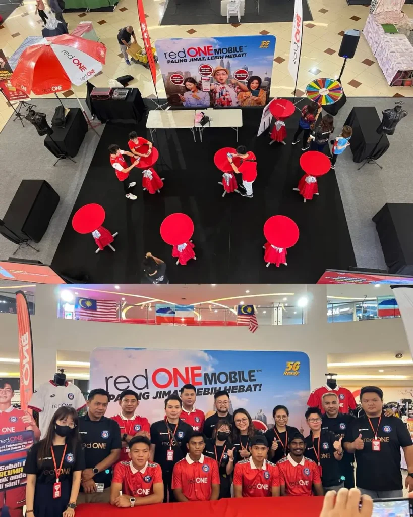 REDone Roadshow: Meet & Greet with Sabah FC (Football Club) 3 redONE Mobile booth at a ITCC mall featuring red tables and promotional 5G banners for local visitors to view