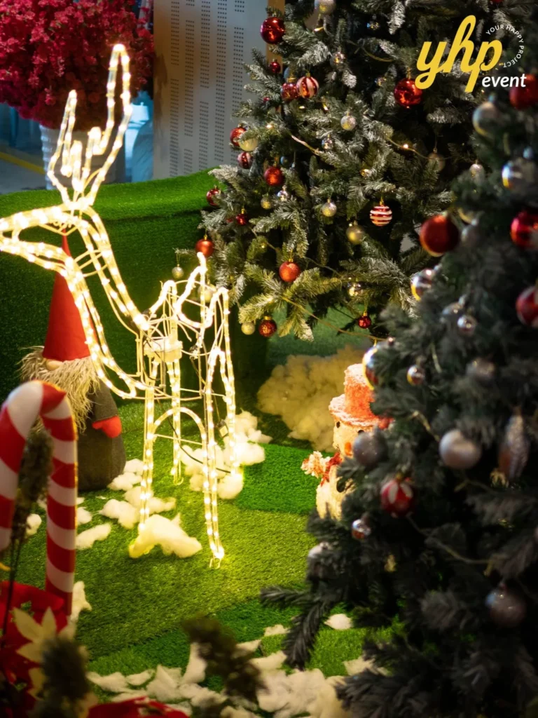Riverson - Christmas & Lunar New Year Decoration 6 Christmas event display with reindeer light sculpture, snowy trees, and festive red ornaments