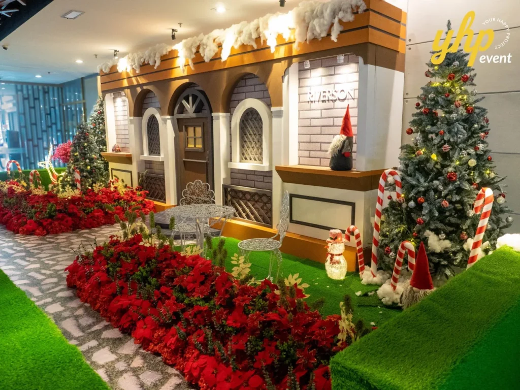 Riverson - Christmas & Lunar New Year Decoration 7 European winter house setup for a Christmas event with snowy roof and poinsettia flowers