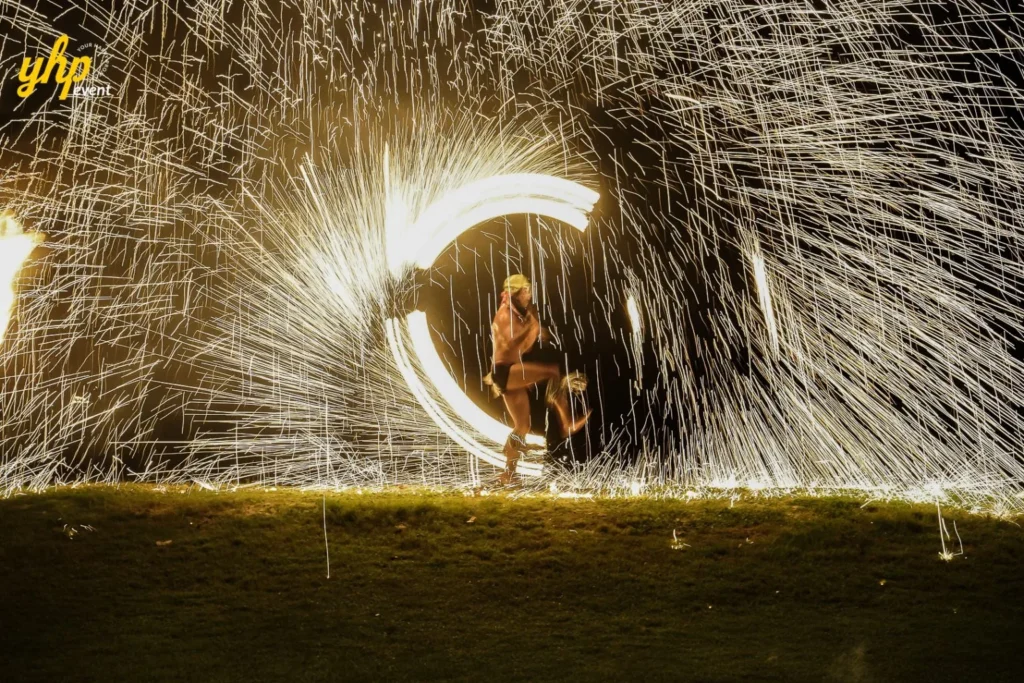 Fire Eating performance sabah Sabah Traditional fire dancer performing an energetic cultural fire show at a luxury beach event at night