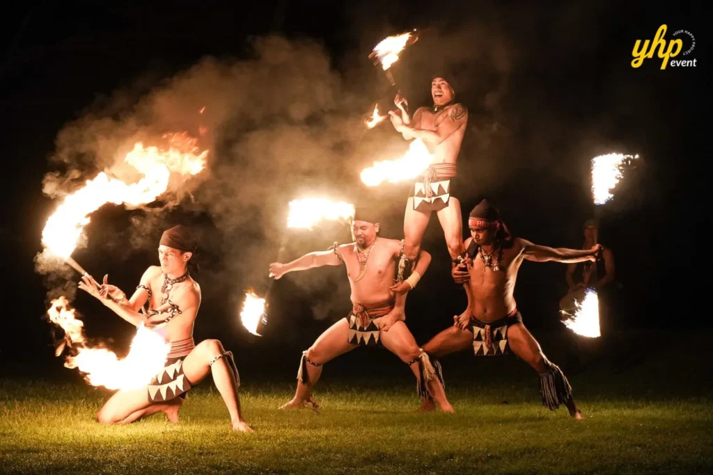 Sabah fire eating show Group of Sabah cultural fire dancers in traditional attire performing
