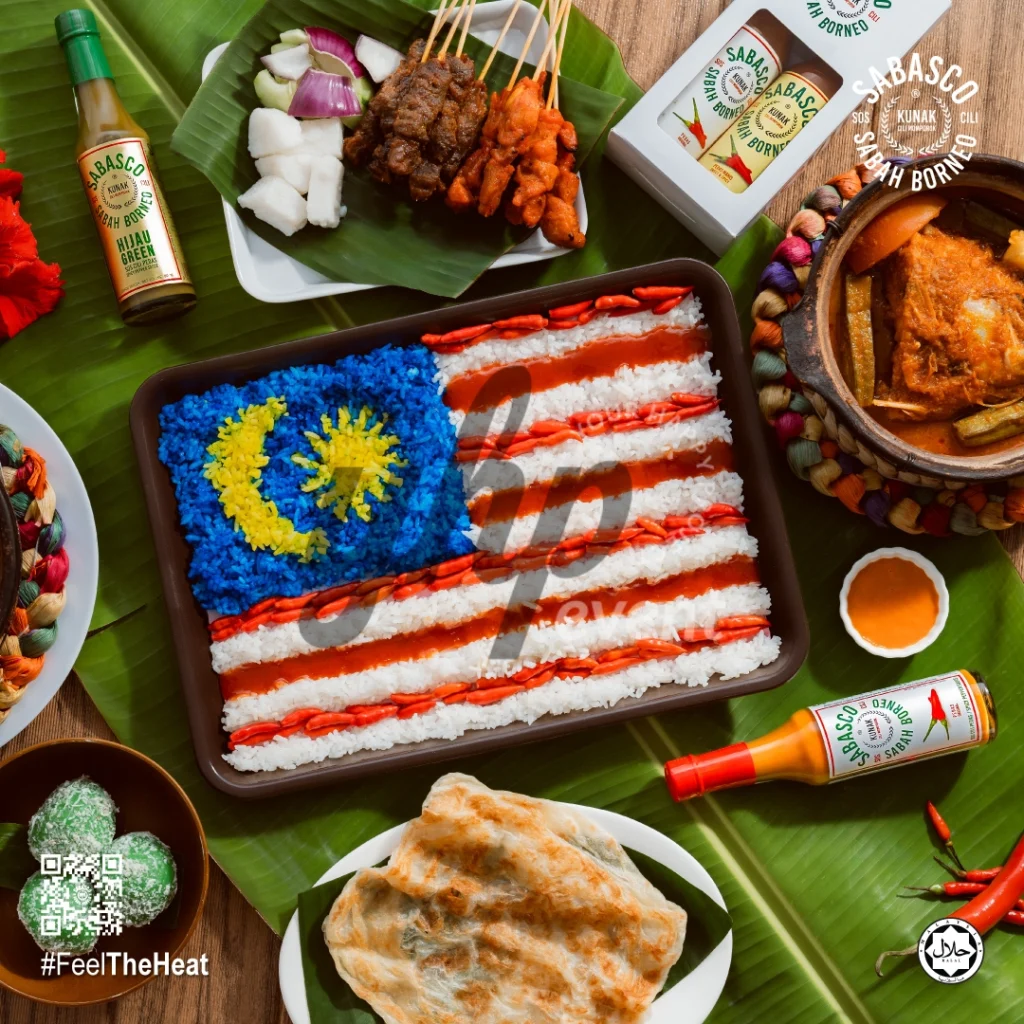The Local Sabah Chili Sauce Brand That’s Heating Up 20 Rice arranged as the Malaysian flag with satay, curry, roti, and Sabasco Sabah Borneo chili sauce around the platter