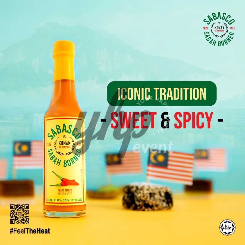 The Local Sabah Chili Sauce Brand That’s Heating Up 21 Sabasco Sabah Borneo sweet and spicy chili sauce bottle styled against a blue backdrop with miniature Malaysian flags