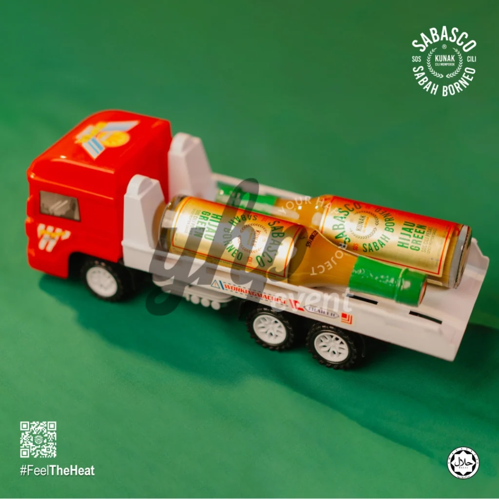 The Local Sabah Chili Sauce Brand That’s Heating Up 30 Red and white toy truck transporting a Sabasco Sabah Borneo Hijau Green chili sauce bottle on green backdrop