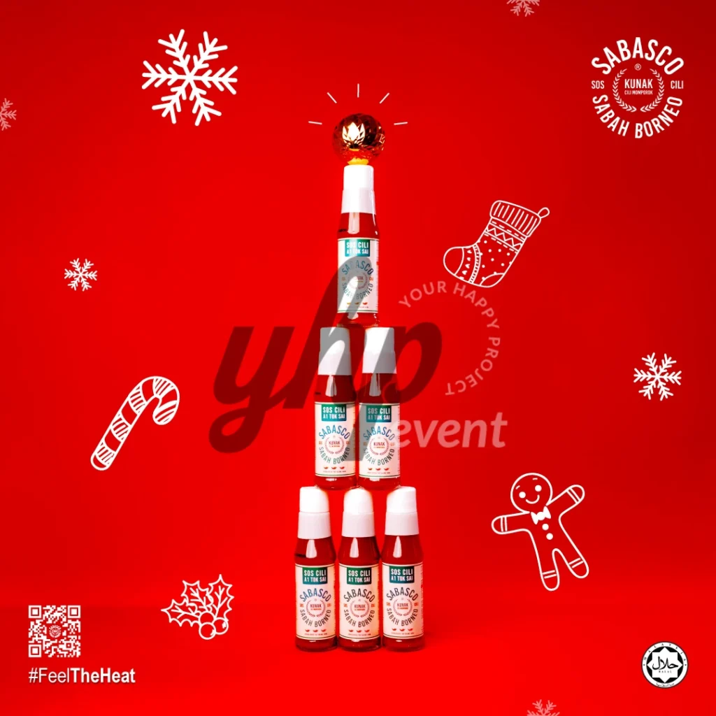 The Local Sabah Chili Sauce Brand That’s Heating Up 32 Six Sabasco Sabah Borneo sauce bottles stacked like a Christmas tree on a red background with festive holiday icons