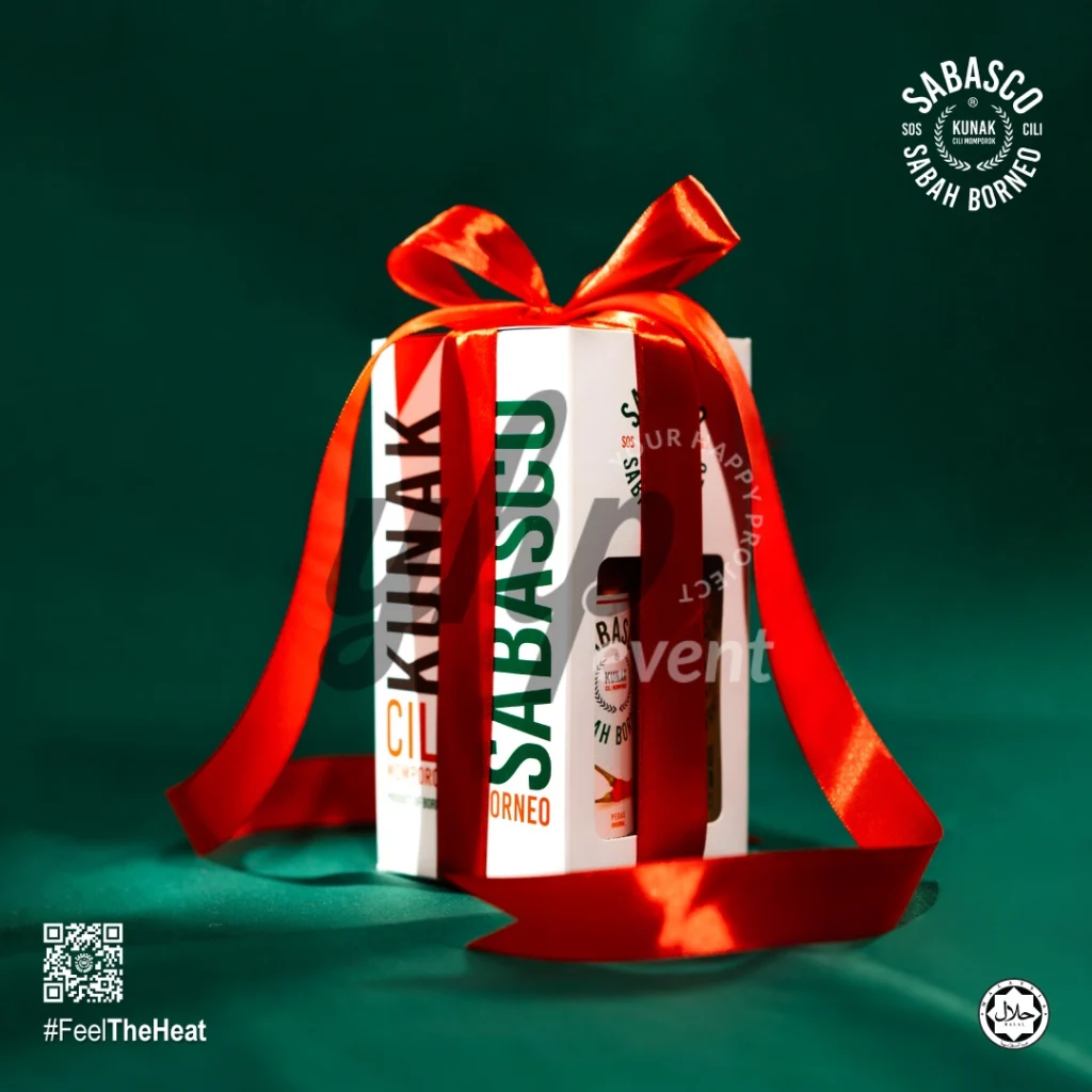 The Local Sabah Chili Sauce Brand That’s Heating Up 33 Sabasco Sabah Borneo gift box wrapped with a red ribbon, partially revealing a chili sauce bottle inside