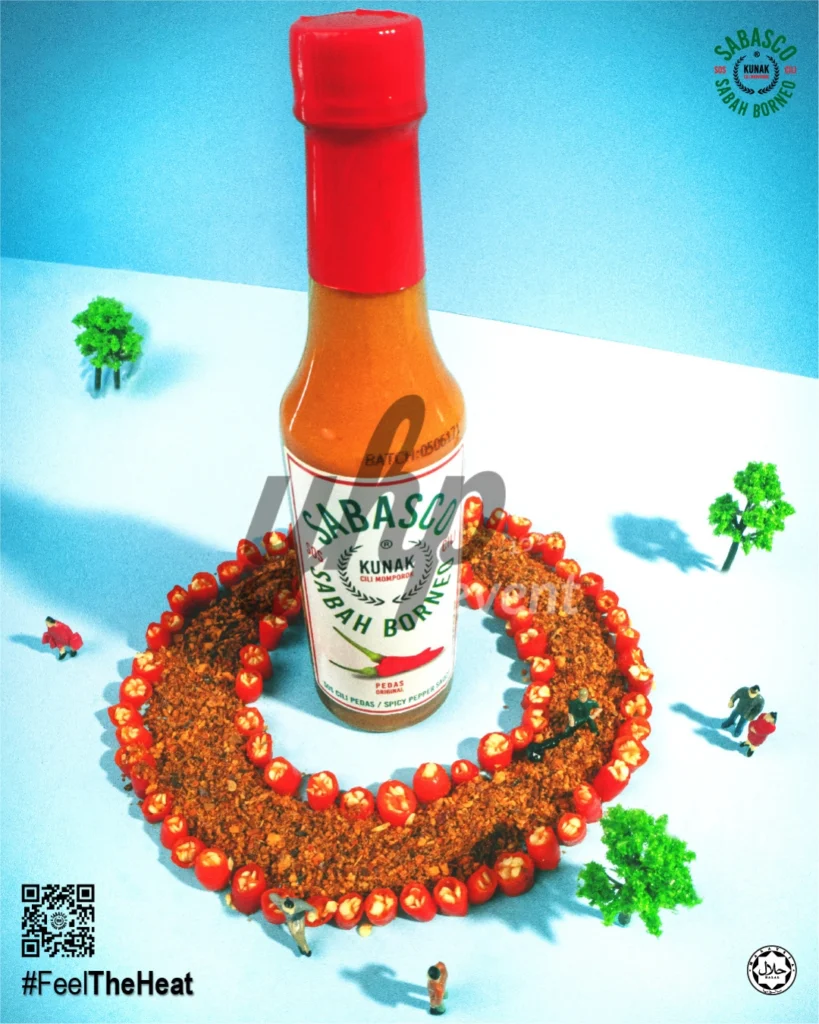 The Local Sabah Chili Sauce Brand That’s Heating Up 41 Single Sabasco Sabah Borneo bottle surrounded by chili slices, spices, miniature trees, and tiny figures