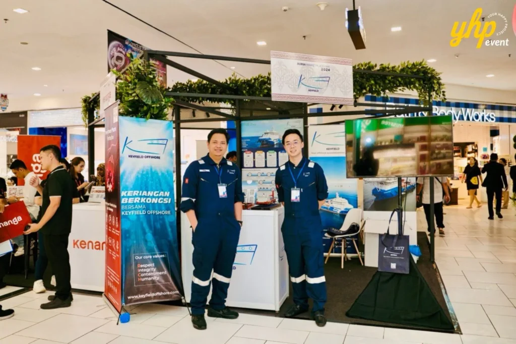 Bursa Marketplace Fair 2024: Sarawak Edition 15 Keyfield Offshore booth staff in blue jumpsuits standing at the Bursa Marketplace Fair 2024 event