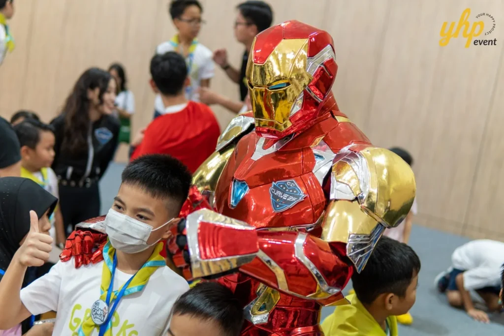 Super Kids Explorer: An Exciting Adventure at Bukit Bantayan 12 Close-up of a child posing with a shiny red and gold Iron Man