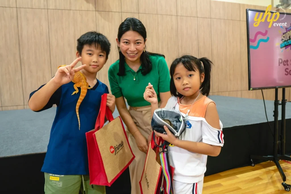 Super Kids Explorer: An Exciting Adventure at Bukit Bantayan 21 Two children holding a bearded dragon and tote bags