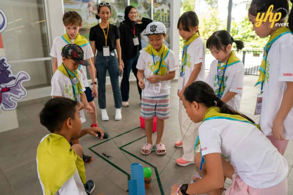 Super Kids Explorer: An Exciting Adventure at Bukit Bantayan 5 A team of children works together to complete a physical puzzle