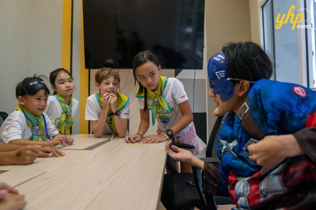 Super Kids Explorer: An Exciting Adventure at Bukit Bantayan 7 A young team listens to instructions from a masked hero