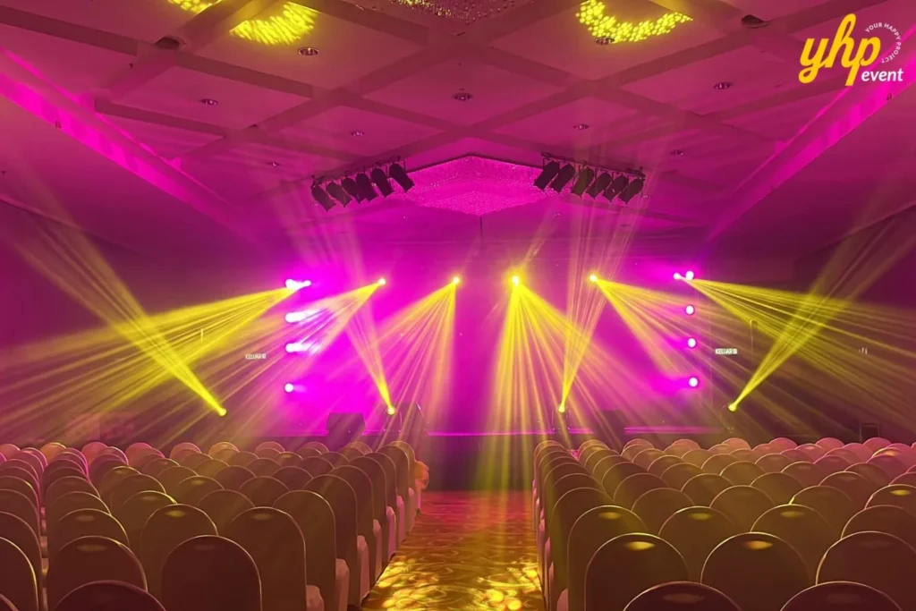 TIENS Sabah Convention l Borneo Royale Hotel Tawau 6 Pink and yellow stage beams illuminate empty rows of seats