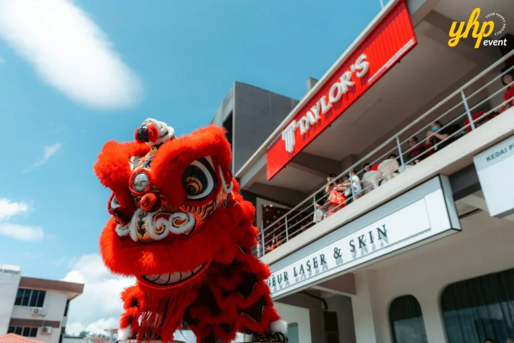 Grand Opening of Taylor's Sabah Counseling Centre 5 Close up of a red and gold traditional lion dance head performing at Taylor's Education Counseling Centre