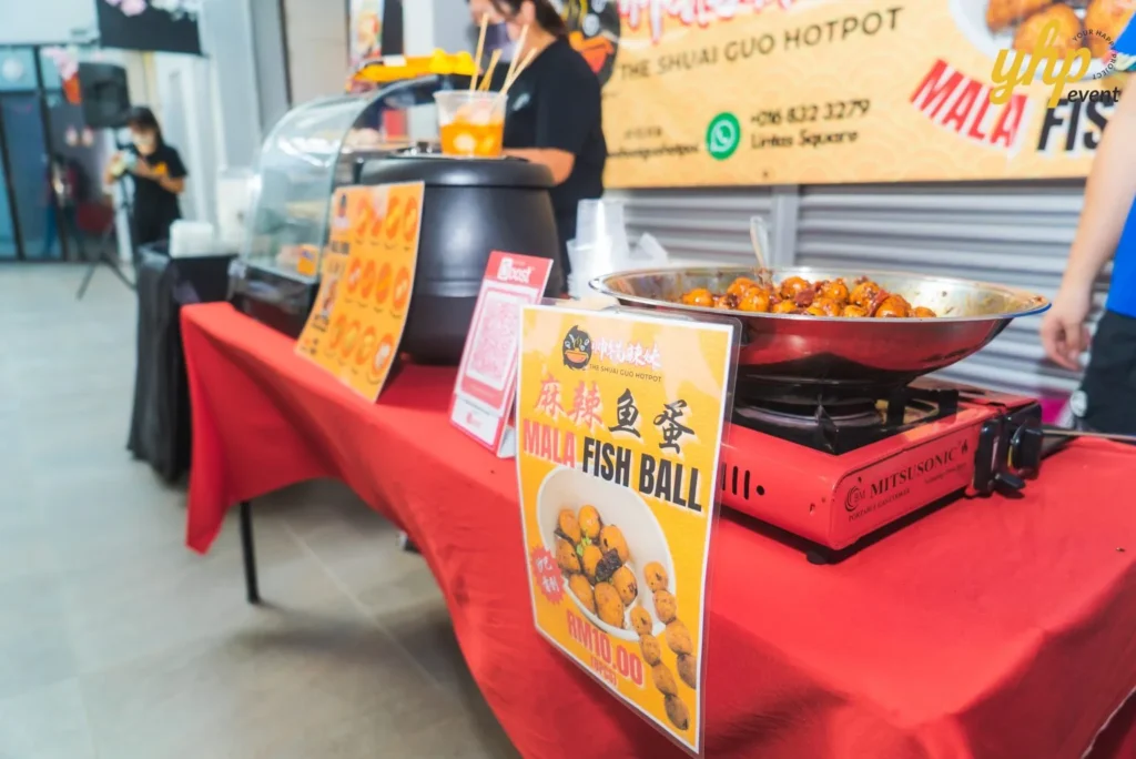 #TooHuattoHandle Lunar New Year Celebration 12 Local Sabahan Mala fish ball stall with steaming cookware, skewers, and menu signage at an indoor street food market