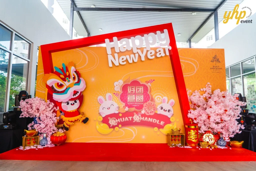 #TooHuattoHandle Lunar New Year Celebration 25 Lunar New Year photo wall with red carpet, cherry blossom decor, and cartoon rabbits inside Bukit Bantayan Residence.