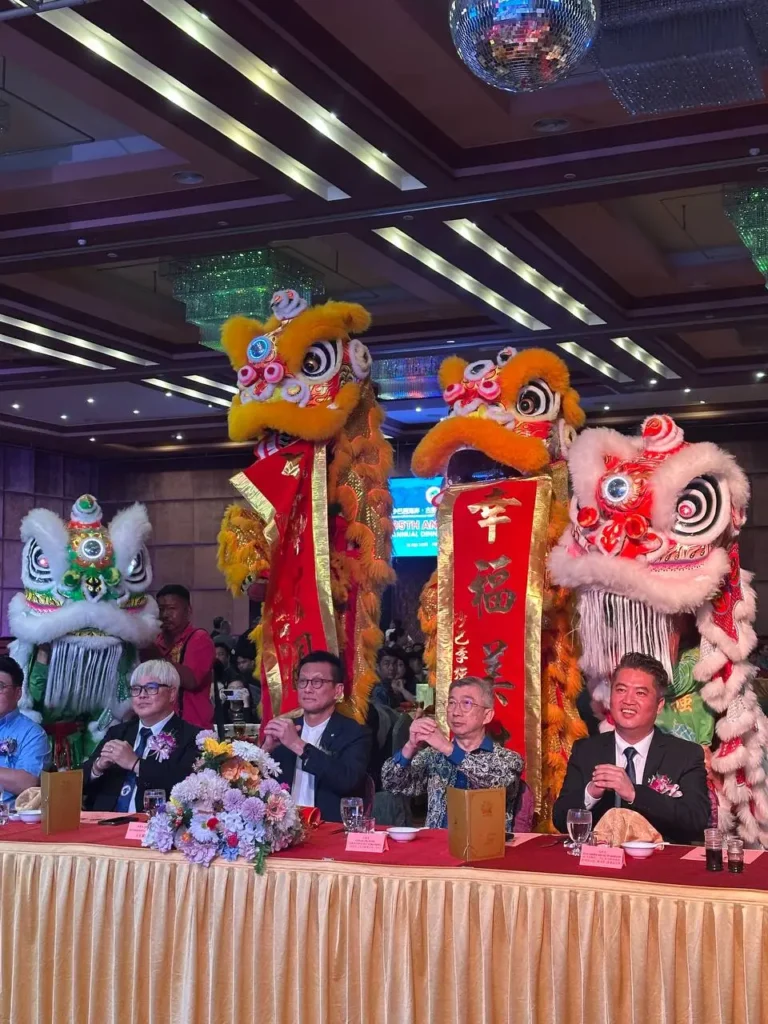 Tyre Association 35th Anniversary Celebration in Kota Kinabalu 9 Lion dance performers greet guests and dignitaries at a banquet table during a festive anniversary dinner