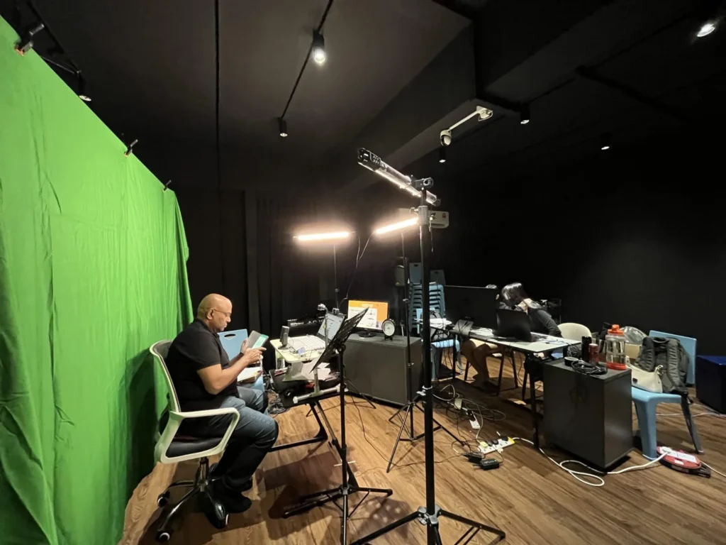 First Ever Virtual Asia Pacific Consultation of Marketplace Mindfulness 4 Production view of a speaker at the virtual consultation on Marketplace Mindfulness using a green screen