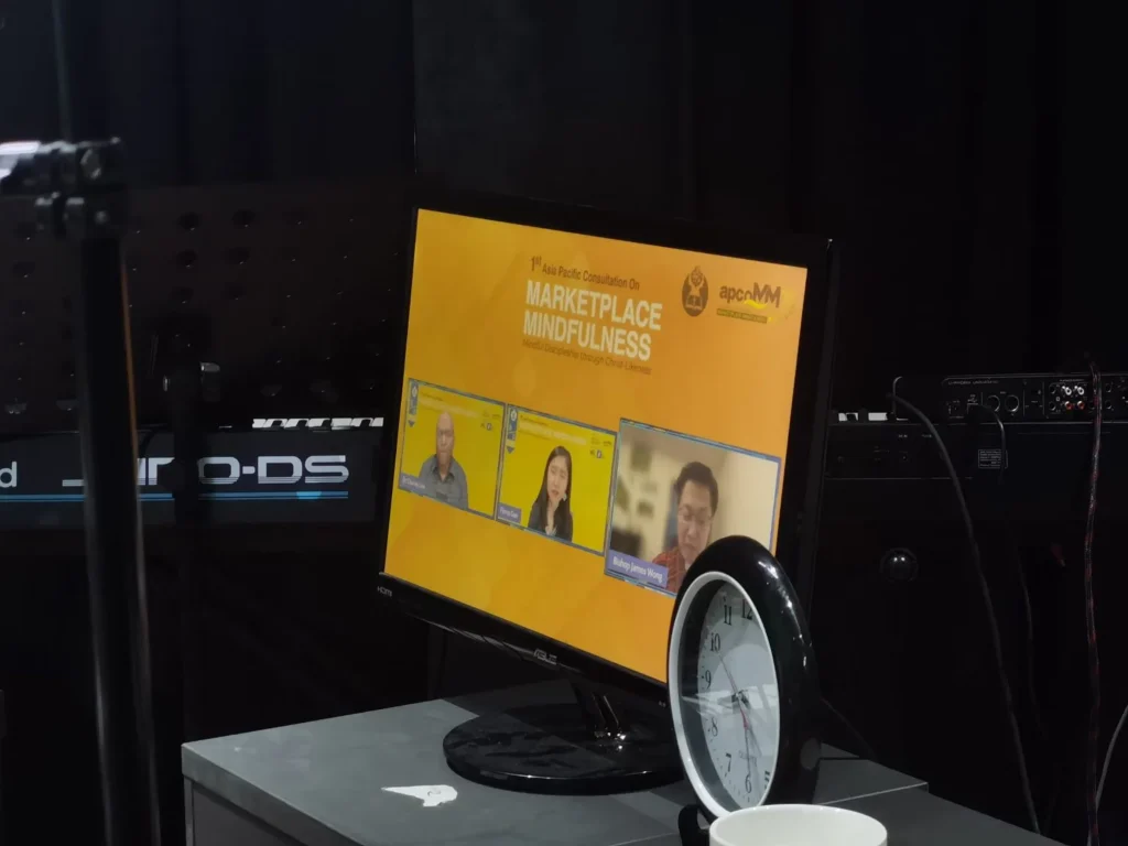 First Ever Virtual Asia Pacific Consultation of Marketplace Mindfulness 5 Monitor displaying a live panel discussion during the virtual Marketplace Mindfulness consultation event