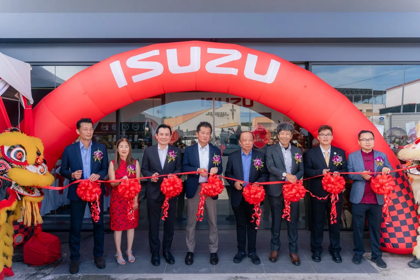 Ribbon-cutting ceremony at Isuzu Showroom Likas, Kota Kinabalu Launching with executives and lion dancers