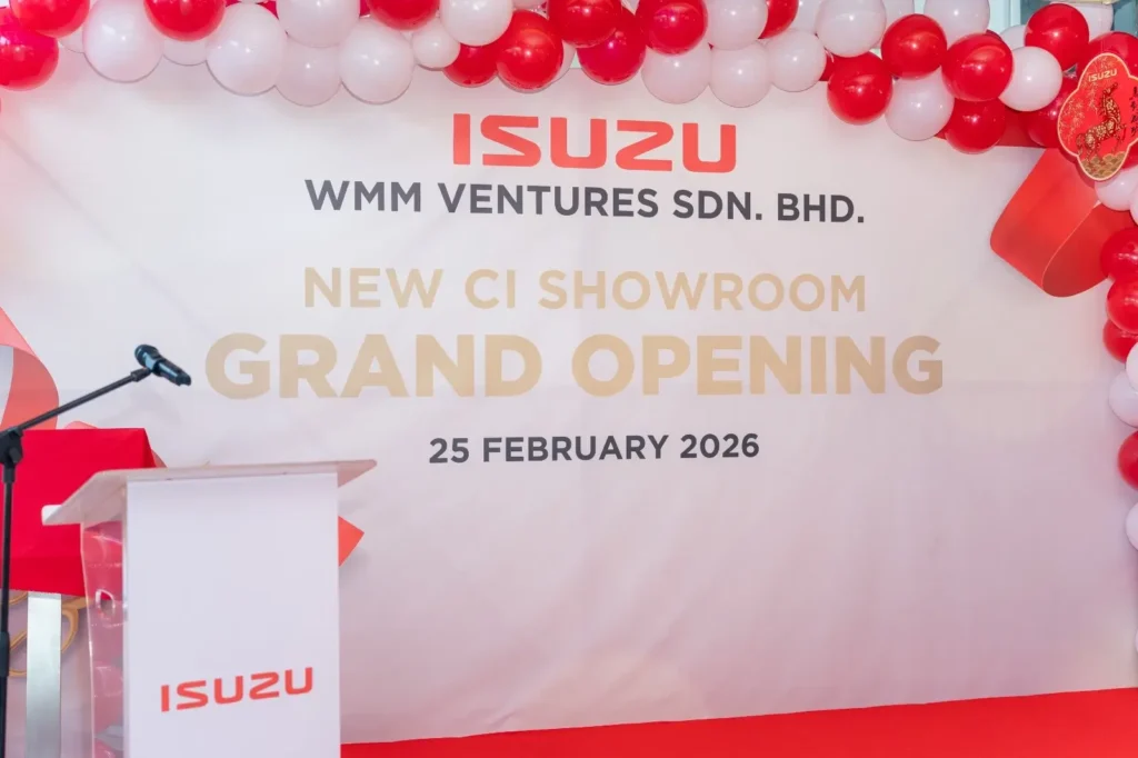 Isuzu Showroom Likas, Kota Kinabalu Launching 6 Grand opening signage at Isuzu Showroom Likas, Kota Kinabalu Launching venue with red and white balloon arch
