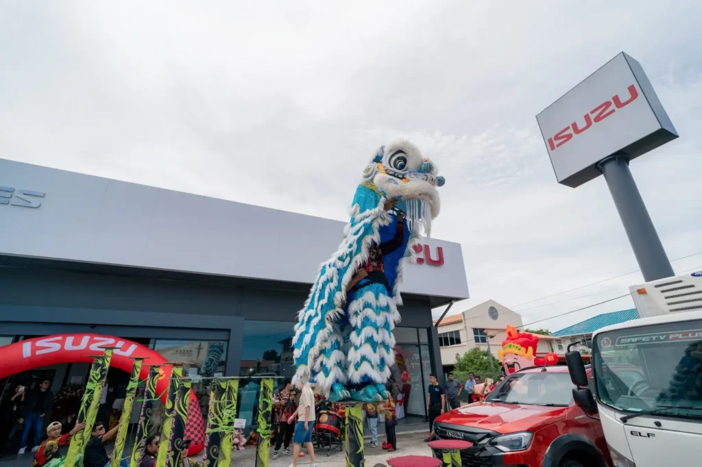 Isuzu Showroom Likas, Kota Kinabalu Launching 10 Stilt lion dance performance outside Isuzu Showroom Likas, Kota Kinabalu Launching beside display vehicles