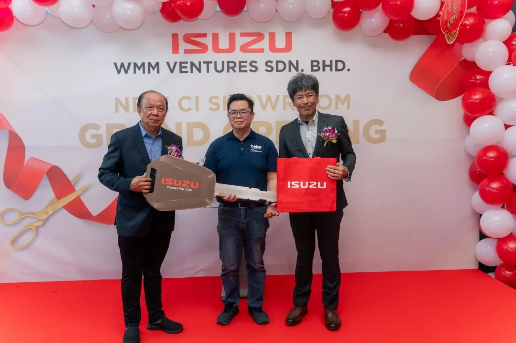 Isuzu Showroom Likas, Kota Kinabalu Launching 4 Key handover photo at Isuzu Showroom Likas, Kota Kinabalu Launching with representatives on opening stage