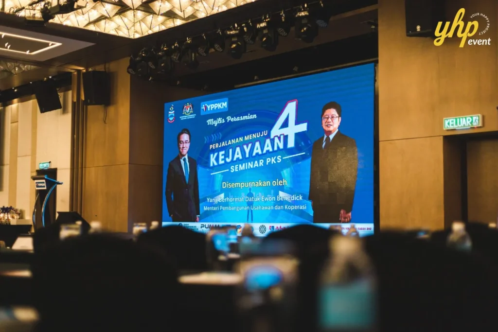 Empowering Entrepreneurs: YPPKM Small Business Seminar in Kota Kinabalu 5 Large digital screen displays the YPPKM seminar PKS opening ceremony featuring Datuk Ewon Benedick in Le Meridien Hotel Kota Kinabalu