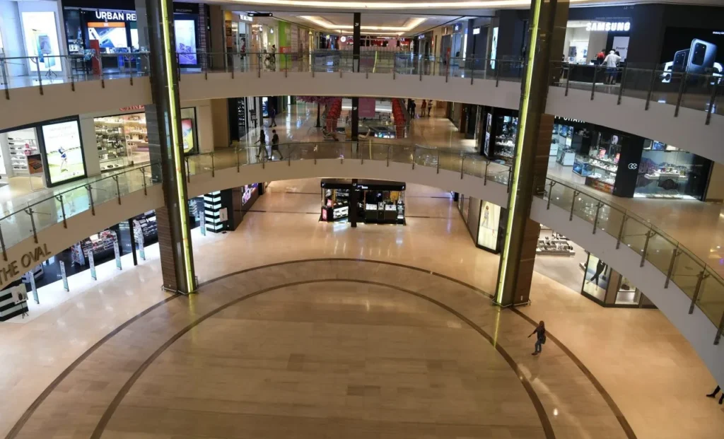 Discover the Top Event Roadshow Venues in Kota Kinabalu, Sabah 4 Interior view of the oval atrium at Imago Mall showing multiple levels of retail shops and walkways