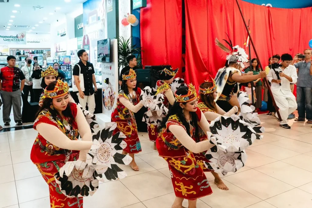 Caring Pharmacy Mural Art Unveiling Ceremony l Farley Mall , Kuching 4 Ngajat dance in front of Caring Pharmacy Farley Mall